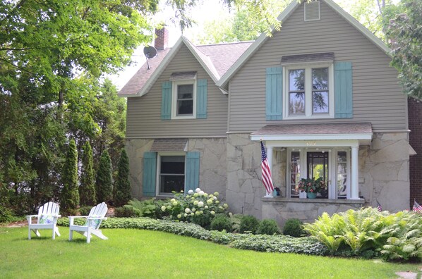 The front of the house with a larger front yard, perfect for croquet or baseball