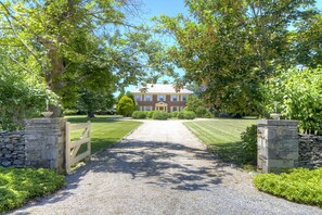 Front entrance of home with circular driveway.