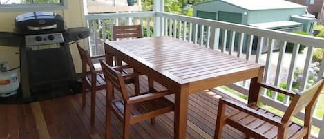 The large back deck has a barbecue and a table that expands to accommodate 8.