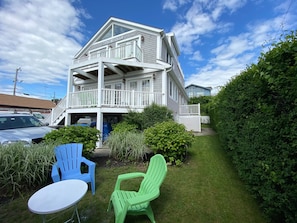 Front side yard.. with additional seating . This in addition to huge back yard.