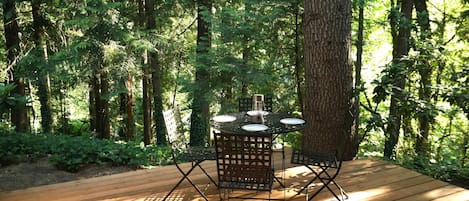 Our private deck with calming forest views. Perfect for eating or having a drink