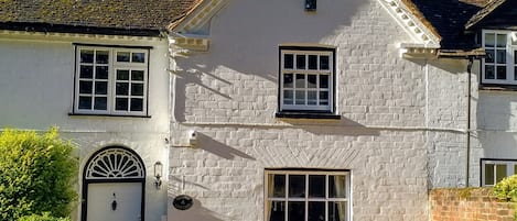 The cottage frontage with two off-road parking spaces.