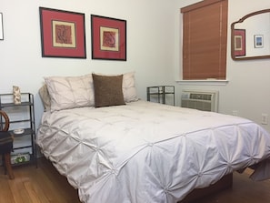 Quiet bedroom with full-size bed.