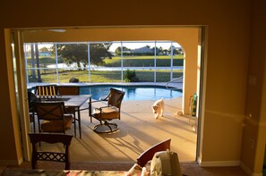 View of pool and lanai from the dining/living room