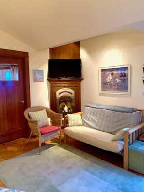 The living room with fireplace  and lovely view