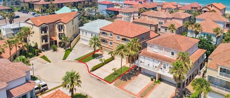 Welcome to 6508B Fountainway! Aerial of our townhome in close proximity to the beach! Great gated subdivision with beach access directly from the community.