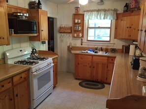 Fully equipped kitchen with dishwasher, new stove, new refridgerator.