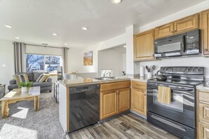The Kitchen offers an Electric Range, Dishwasher, Microwave and Refrigerator.