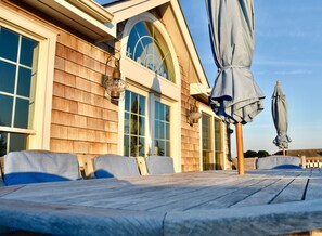 Deck with water and sunset views