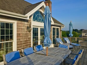 Enjoy sunset views over the water from the deck. 
