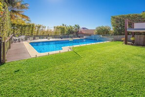 the landscaped garden with shimmering pool
