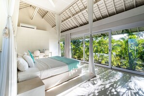 Bedroom with 1 king bed and pool and rice fields view