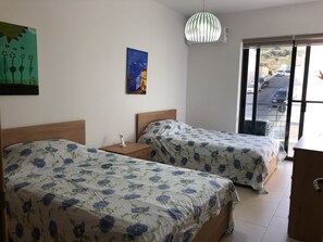 A second bedroom with two double beds