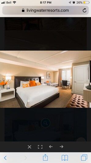 Luxurious master bedroom with king bed and spa-like ensuite bathroom
