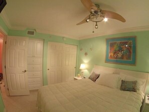 bedroom with flat screen TV, iPod docking alarm clock built in drawers