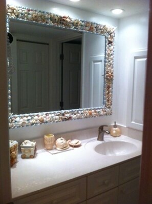 New bathroom shell mirror and paint no more bright green in the sink area