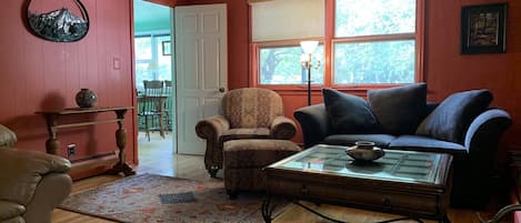 Living room , looking into sunroom/ dining room 