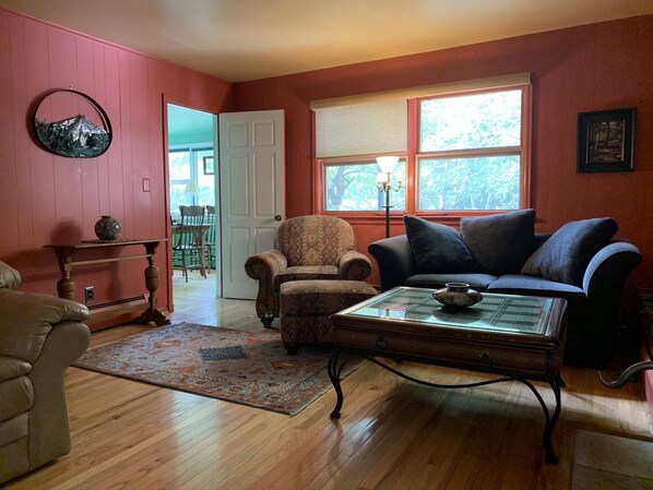 Living room , looking into sunroom/ dining room 