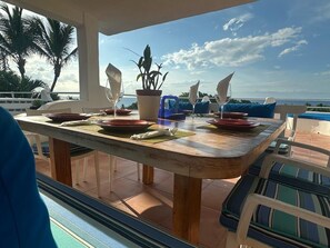 Square table with two benches and four chairs. Can seat up to 10 people