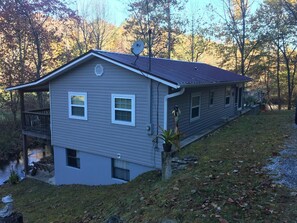 View of the house as you pull up the gravel driveway. 