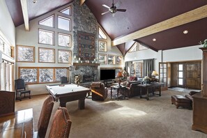 Large, Open Living/Dining Room Surrounding Wood Burning Fireplace 