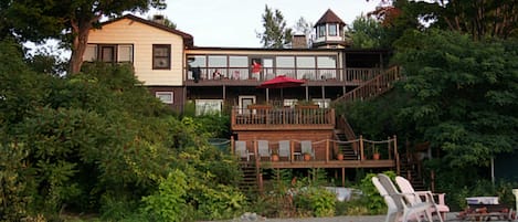 Apartment opens to three levels of decks leading to our beach.