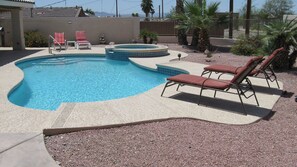Pool and spa with loungers