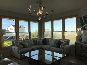 Den with sectional sofa and 50” TV