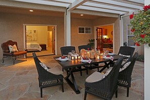 Linger after dinner under the arbor on the patio