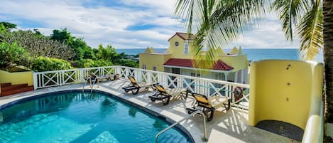 The pool with a view of the Caribbean Sea! Enjoy a dip as the sun sets!