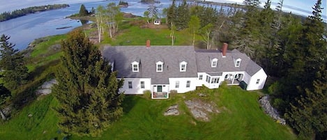 Aerial view of house w/ a 220-degree oceanfront view.