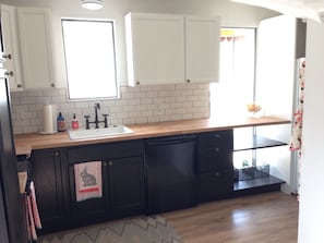 Fully outfitted kitchen with coffee, tea and fixins.