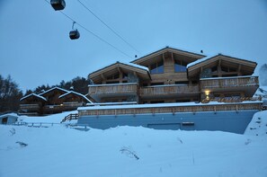 Exterior building in winter. Next to the ski slope 