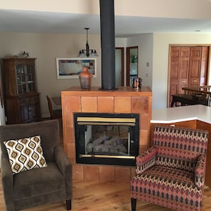 Two-sided gas fireplace warms both living and dining areas