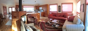 Panoramic view of open-concept living room, kitchen, and dining room...