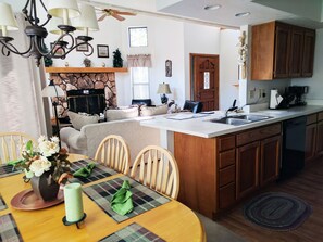 Fireplace can be enjoyed from the dining room and kitchen as well.