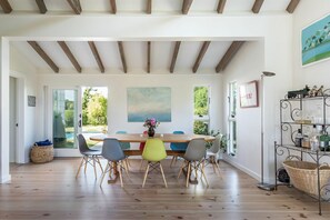 Dining room area, seats up to 10, with sliding door to pool area.
