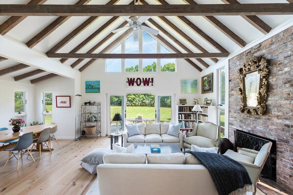 Living room, looking out toward Accabonac Harbor, water views.
