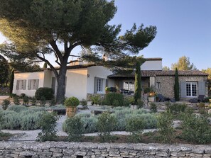 View of stone and stucco house from the garden