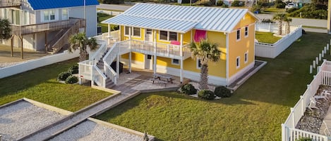 Beautiful beach house with palm trees directly across from the Beach Access.