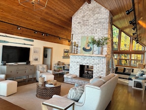 Enjoy the massive vaulted ceilings and double-sided fireplace in this Great Room
