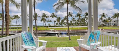 Enjoy the keys lifestyle on your porch, overlooking your boat slip, the pool and the Gulf of Mexico!