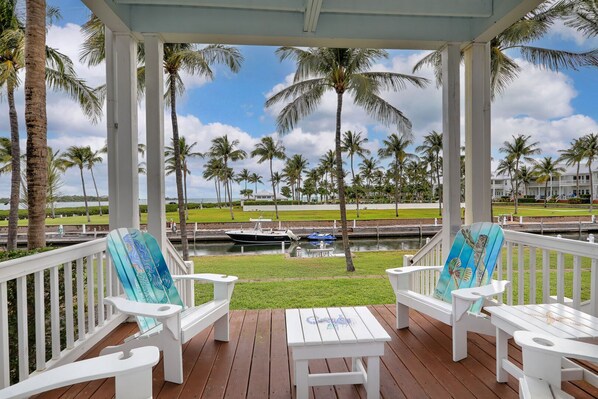 Enjoy the keys lifestyle on your porch, overlooking your boat slip, the pool and the Gulf of Mexico!