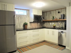 Granite counters, full-sized refrigerator, dishwasher, convection microwave oven