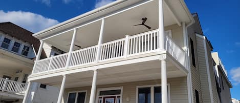 Newly covered front deck with recessed lighting and ceiling fans