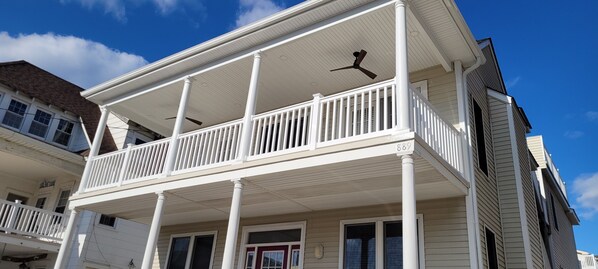 Newly covered front deck with recessed lighting and ceiling fans