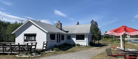 Side and front of cottage from parking area.