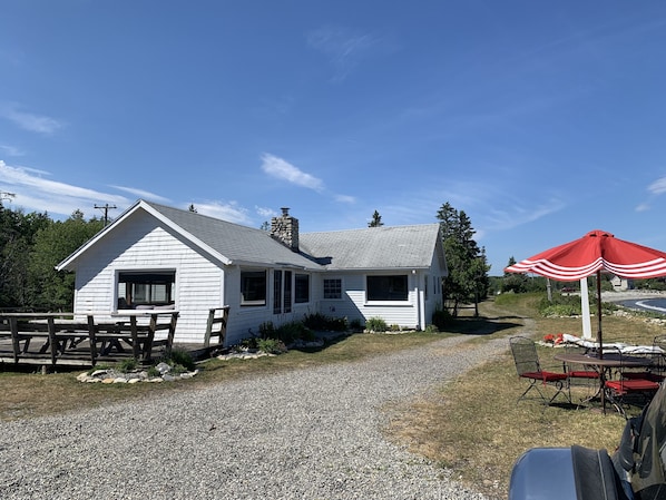 Side and front of cottage from parking area.