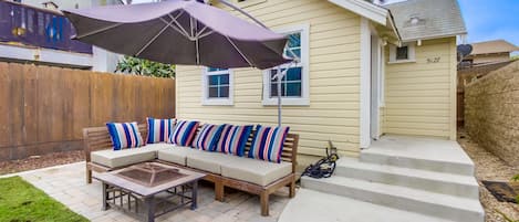 Front yard entertaining space with fire pit.