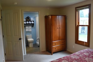 Armoire stores extra sheets and blankets plus room to hang your clothes